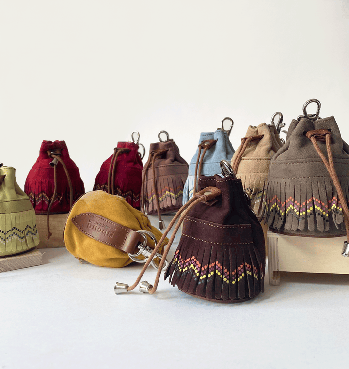 Portamonete in pelle con frange