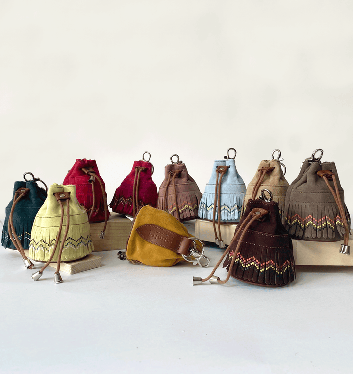 Portamonete in pelle con frange